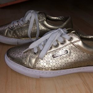 Gold tennis shoes